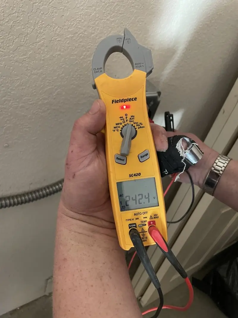Voltage testing with clamp meter during Electrical Installation Services in Newington